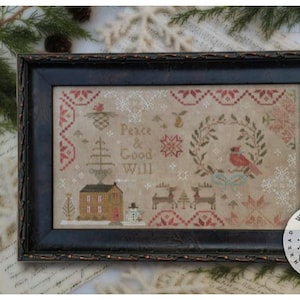 May include: A cross-stitch pattern featuring a winter scene with a red cardinal, a house, trees, and the text "Peace & Good Will". The pattern is framed in a black frame and has a brown background.