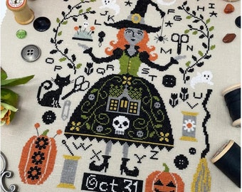 May include: Cross stitch pattern featuring a witch with a black and green dress, a pumpkin, a black cat, and the alphabet. The pattern includes the text "Oct 31".
