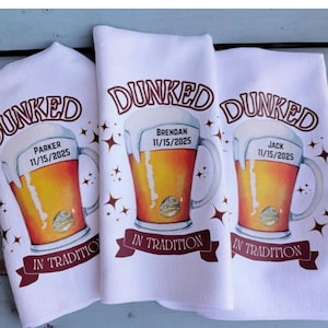 May include: Three white kitchen towels featuring a graphic of a beer mug filled with golden liquid and white foam. The text reads DUNKED IN TRADITION with names Parker, Brendan, and Jack, and the date 11/15/2025 printed on each mug.