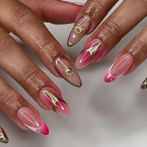 Luxury custom nails/ free style/ long nails/gold chrome nails/ 3D gel nails/flower nails/ trendy nails/ pink nails/ almond stiletto nails