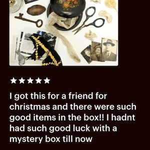 May include: A collection of vintage items including a black lacquered box with floral design, a key, scissors, and a photograph. The image also includes a butterfly, a bone, and a small book titled "The Golden Land."