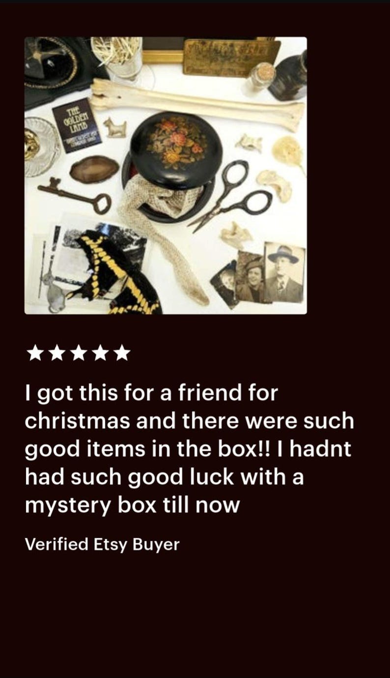 May include: A collection of vintage items including a black lacquered box with floral design, a key, scissors, and a photograph. The image also includes a butterfly, a bone, and a small book titled "The Golden Land."