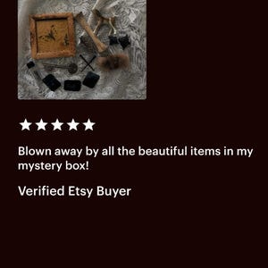 May include: An assortment of vintage-style items, including a small framed picture with a butterfly, a miniature horse figurine, a bone, keys, and small black objects, arranged on a textured surface.