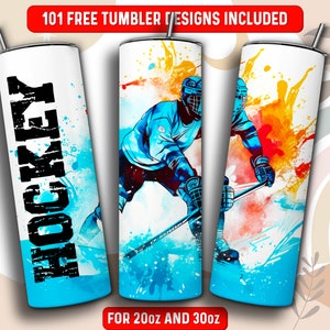 May include: A white tumbler with a blue and orange watercolor design of a hockey player. The tumbler has the word "HOCKEY" printed in black on the front. The tumbler is for 20 oz and 30 oz.