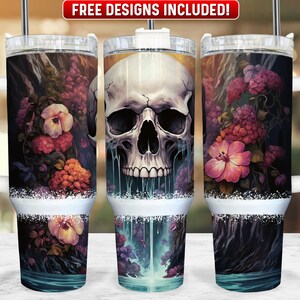May include: A stainless steel tumbler with a white lid and handle. The tumbler features a design of a skull with dripping water and flowers. The design is in shades of pink, purple, orange, and green.