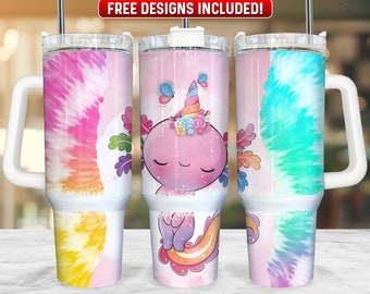 May include: Three stainless steel tumblers with lids and handles. Each tumbler features a different tie-dye pattern in pink, yellow, blue, and purple. The center tumbler has a cartoon axolotl with a unicorn horn and flowers on its head.