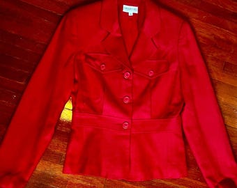 May include: A vibrant red blazer with a tailored fit. The jacket features a notched collar, two front pockets, and a button-down closure. The blazer has a fitted waist and long sleeves. The label reads "FRANCO GIANNI".