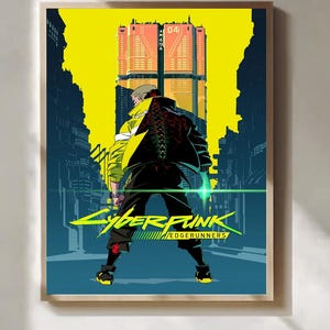 Puede incluir: P&oacute;ster enmarcado con una ilustraci&oacute;n estilizada de Cyberpunk: Edgerunners. La obra representa una figura con una chaqueta negra con dise&ntilde;o de columna vertebral roja, frente a una ciudad futurista. El t&iacute;tulo "Cyberpunk: Edgerunners" se muestra en amarillo y verde.
