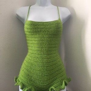 May include: A lime green crocheted bodysuit with a ruffled hem.