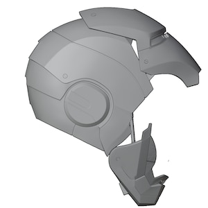 May include: A gray 3D model of a helmet with a futuristic design. The helmet has a large, round visor and a series of panels and vents.