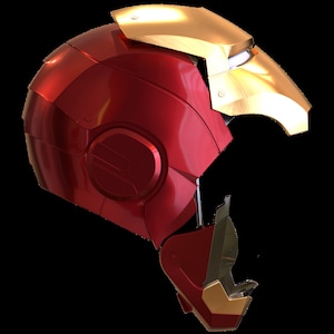 May include: A red and gold helmet with a visor. The helmet is open on one side, revealing the interior.