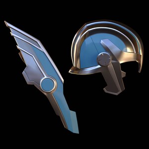 May include: A silver and blue helmet with a wing-shaped accessory. The helmet has a rounded top and a visor. The wing accessory has a pointed tip and a circular design in the center.