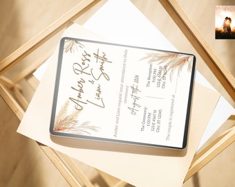 May include: A digital invitation with the names "Amber Ross & Liam Smith" in elegant script, featuring pampas grass accents. The invitation details the ceremony and reception information for August 15th, 2024, in a neutral color palette.