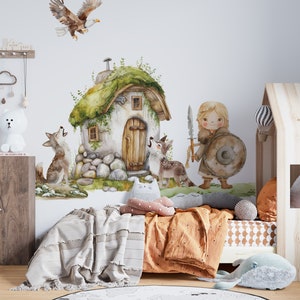 May include: A watercolor illustration of a girl warrior with a sword and shield, standing in front of a small stone house with a green roof. Two wolves are howling at the house, and an eagle is flying overhead.