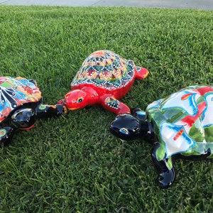 Collection of Talavera turtles statues in different designs.