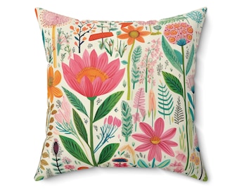 May include: Square throw pillow with a colorful floral pattern. The design features large pink and orange flowers, green leaves, and various other plants on a cream background. The pillow is a square shape.