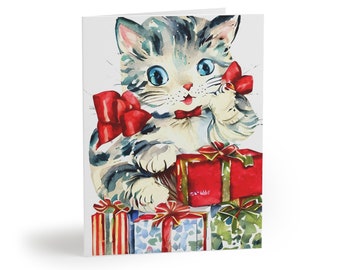 Puede incluir: Una ilustración de acuarela de un gatito gris y blanco con un lazo rojo sentado encima de una pila de regalos envueltos con lazos rojos. Los regalos están envueltos en varios patrones, incluyendo rayas rojas y blancas, lunares azules y blancos y flores verdes y blancas.