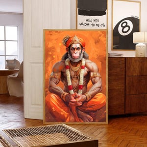 May include: A painting of a monkey deity wearing a red and gold headdress and a garland of flowers. The monkey is sitting in a meditative pose with its hands clasped in front of its chest. The background is a vibrant orange color.