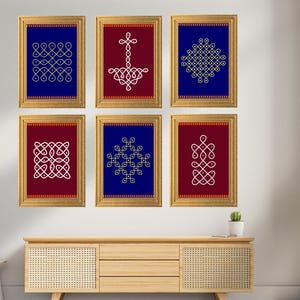 May include: Six framed art prints with gold frames. The prints feature intricate white and gold geometric designs on a blue and burgundy background. The artwork is displayed above a wooden cabinet, creating a decorative wall arrangement.