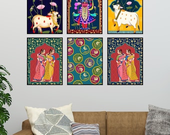 May include: Set of six framed prints featuring colorful Indian-inspired artwork. The prints depict a deity, two women, a cow, and a floral pattern.