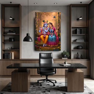 May include: A framed artwork showing a couple in traditional Indian dress, seated on a swing in a floral setting. The artwork uses vibrant colours, with the couple in yellow, blue, and pink garments. A bird flies in the background.
