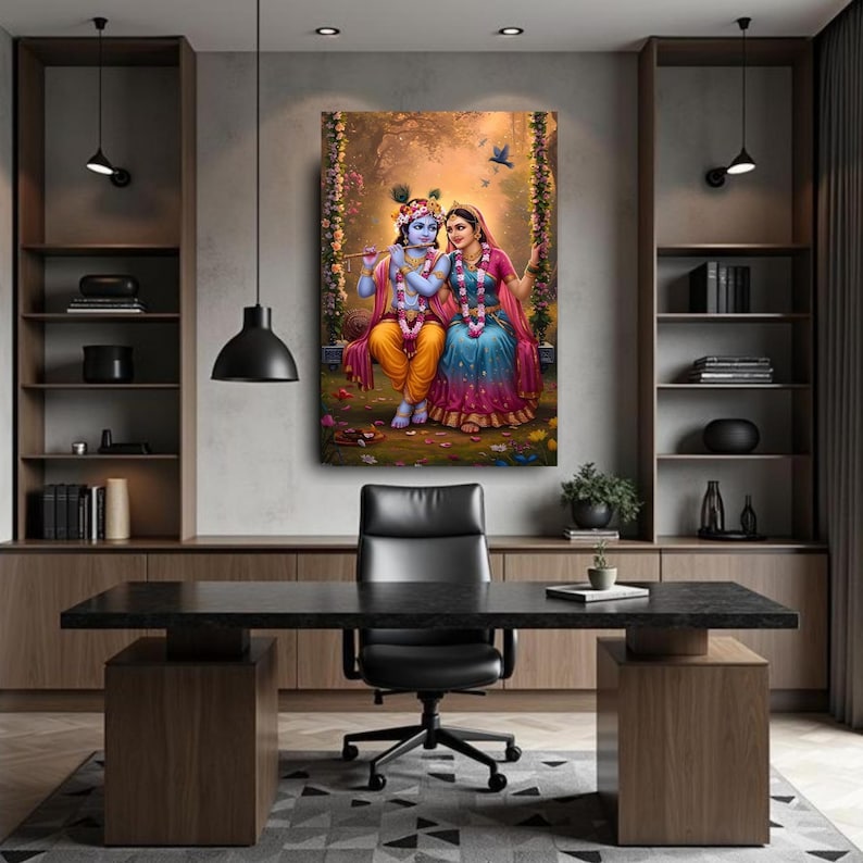 May include: A framed artwork showing a couple in traditional Indian dress, seated on a swing in a floral setting. The artwork uses vibrant colours, with the couple in yellow, blue, and pink garments. A bird flies in the background.