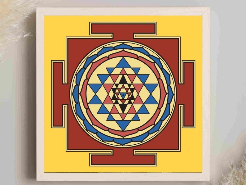 May include: A yellow square with a red square inside. The red square has a blue and red mandala with a geometric pattern inside. The mandala is surrounded by a blue and red border.