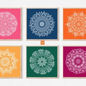 May include: Six printable wall art prints featuring white mandala designs on different colored backgrounds. The colors are pink, blue, orange, yellow, green, and burgundy.