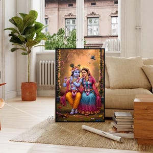May include: A framed artwork showing a couple in traditional Indian dress. The figures wear jewellery and floral garlands, set against a backdrop of a garden with birds. The artwork is displayed in a living room setting.