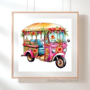 May include: A framed watercolor print of a pink tuk-tuk adorned with vibrant orange and pink flowers. The vehicle has a yellow roof and blue seats. The artwork is set against a white background and framed in a light wood frame.