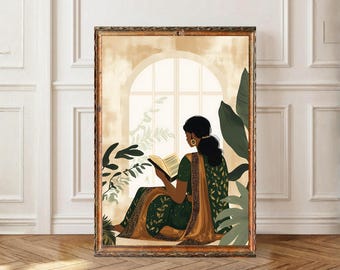 May include: An art print depicts a person in a green and gold sari reading a book by a window. The artwork is framed in a brown wooden frame. Green plants surround the person and window, adding a natural element to the scene.