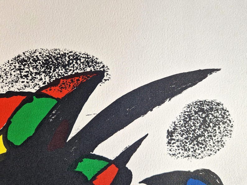 May include: Abstract art print featuring bold black brushstrokes and colorful geometric shapes in red, green, and yellow against a white background. The artwork has a textured, speckled appearance.