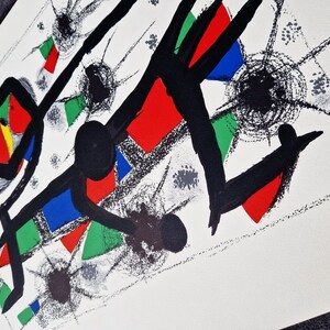 May include: Abstract art print featuring black lines, red, blue, and green geometric shapes, and black dots on a white background.