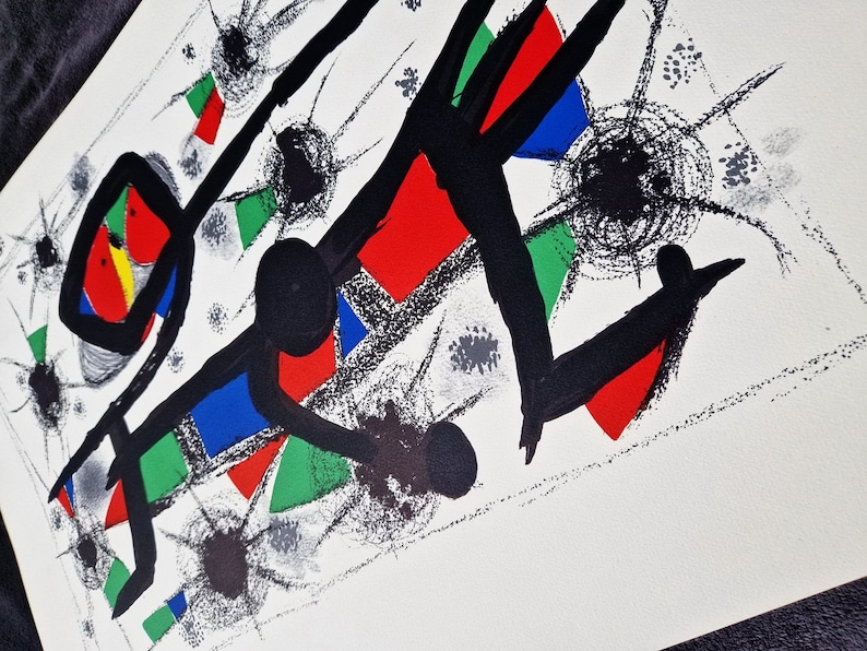 May include: Abstract art print featuring black lines, red, blue, and green geometric shapes, and black dots on a white background.