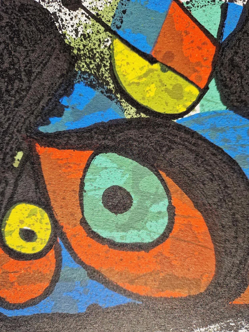 May include: Abstract artwork featuring bold shapes and colors. The composition includes a large eye with a green iris and black pupil, surrounded by orange and brown. Other shapes include yellow, blue, and black elements, creating a vibrant and dynamic design.
