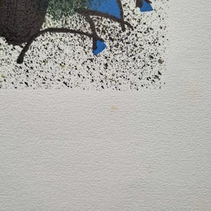 May include: Abstract artwork with a white background and colorful splatters. The upper portion features black, orange, and blue shapes with black lines. The artwork has a textured appearance.