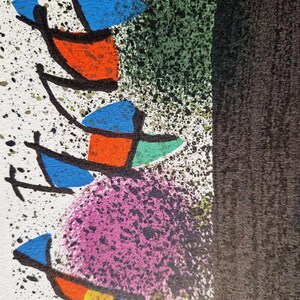 May include: Abstract art print featuring colorful shapes and splatters. The artwork includes blue, orange, green, and yellow geometric forms against a white background with black splatters. A large black shape is on the right side of the image.