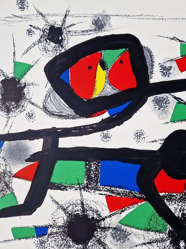 May include: Abstract art print featuring a black, red, green, blue, and yellow design on a white background. The print has a bold, graphic style and is reminiscent of modern art.