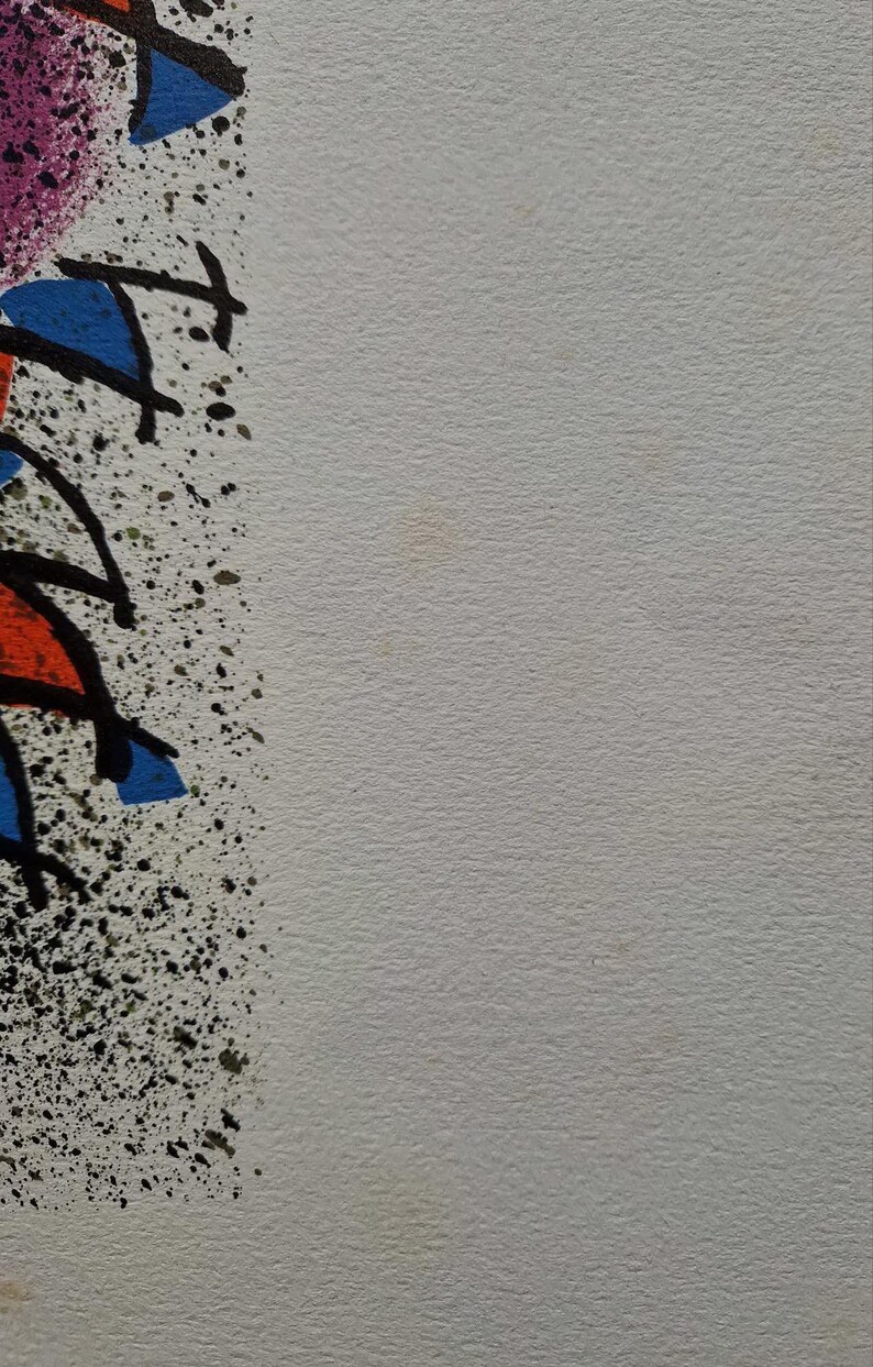 May include: Abstract art print with a white background and colorful shapes. The artwork features blue, red, and purple shapes outlined in black, with black splatter details. The style is reminiscent of graffiti art.