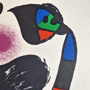 May include: Abstract art print featuring bold shapes and colors. The artwork includes black, red, blue, green, and purple elements against a white background. The design has a modern, graphic style, with a focus on geometric forms and color contrast.