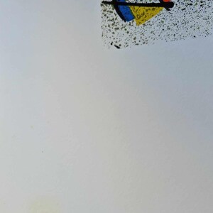 May include: Abstract art print featuring a black shape with red and yellow accents, and a blue triangle. The artwork has a white background with a speckled green and black area in the upper right corner.