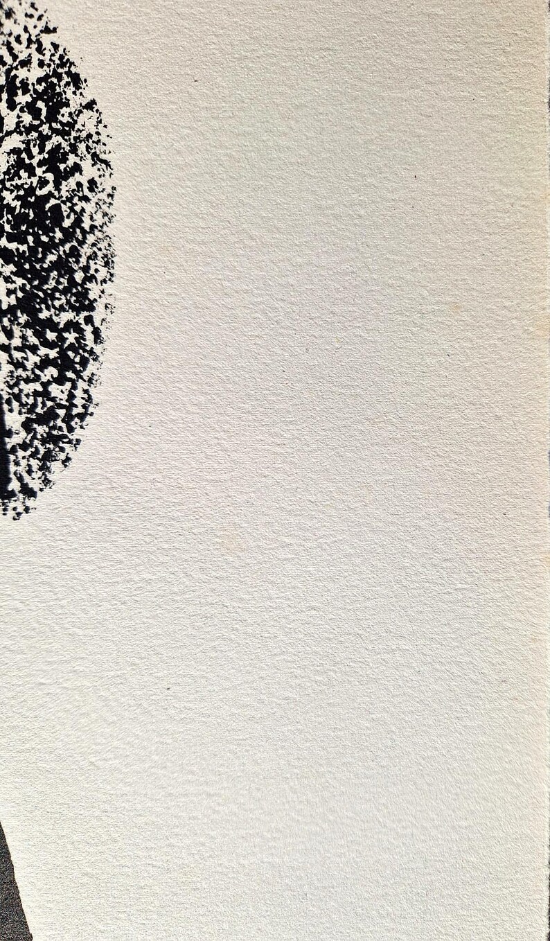 May include: Abstract artwork featuring a textured, off-white paper background. A portion of a black, speckled shape is visible in the upper left corner. The artwork has a minimalist aesthetic.