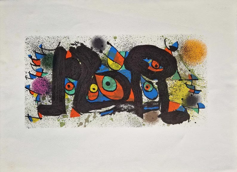 May include: Abstract art print with black, orange, blue, and green shapes on a white background. The artwork features splattered paint and colorful, stylized figures, creating a vibrant and dynamic composition.