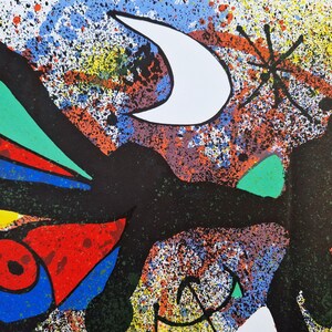 May include: Abstract painting with a black, white, and green figure on a colorful background with splashes of paint. The background includes a white crescent moon and a black star.