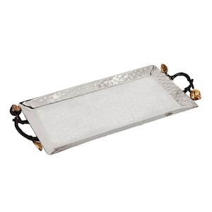 May include: A silver rectangular serving tray with a hammered texture and black and gold leaf decorative handles in the shape of branches with leaves and fruit.