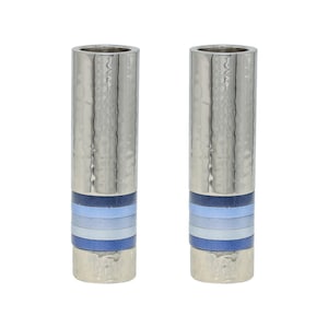 May include: A pair of silver menorah candle holders with blue and white striped bands around the base.