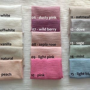 May include: A collection of 15 fabric swatches in various colors, including white, off-white, vanilla, natural, peach, dusty pink, wild berry, sepia rose, light pink, pink, oatmeal, dove, sage, mint, and light blue. Each swatch is labeled with a number and color name.