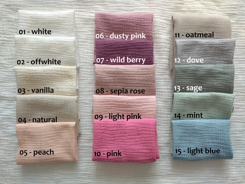 May include: A collection of 15 fabric swatches in various colors, including white, off-white, vanilla, natural, peach, dusty pink, wild berry, sepia rose, light pink, pink, oatmeal, dove, sage, mint, and light blue. Each swatch is labeled with a number and color name.