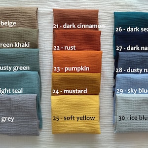 May include: A collection of fifteen folded fabric swatches arranged in three columns, each labeled with a number and color name: 16-beige, 17-green khaki, 18-dusty green, 19-light teal, 20-grey, 21-dark cinnamon, 22-rust, 23-pumpkin, 24-mustard, 25-soft yellow, 26-dark sea, 27-dark navy, 28-dusty navy, 29-sky blue, and 30-ice blue.