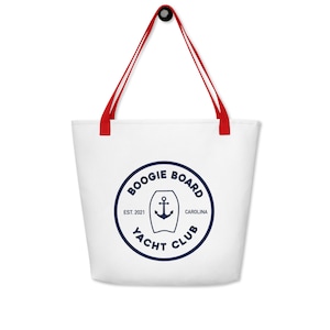 May include: White canvas tote bag with red handles and a blue and white logo that says "Boogie Board Yacht Club Est. 2021 Carolina" with an anchor and a surfboard graphic.